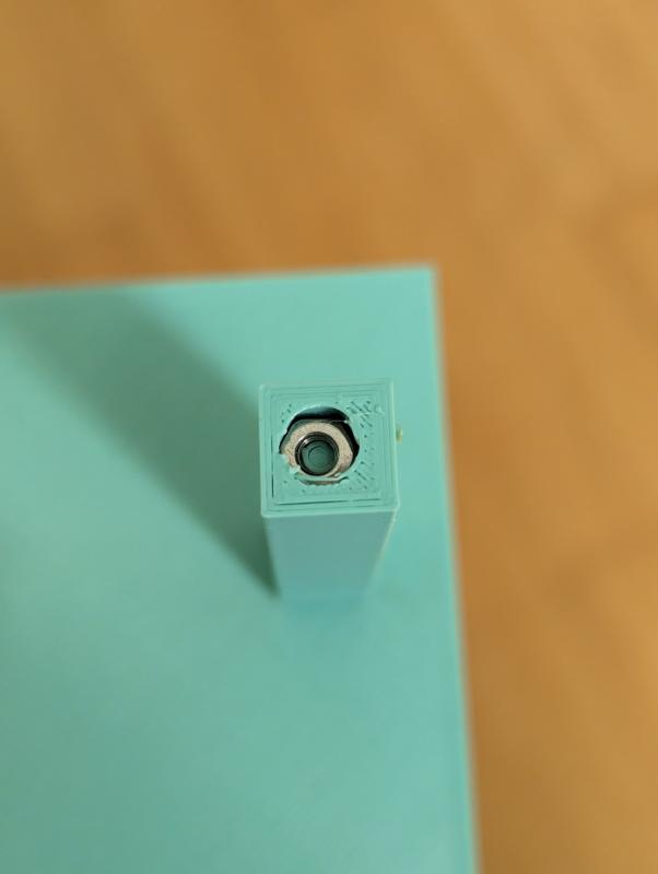 A nut is inside a 3d printed pillar